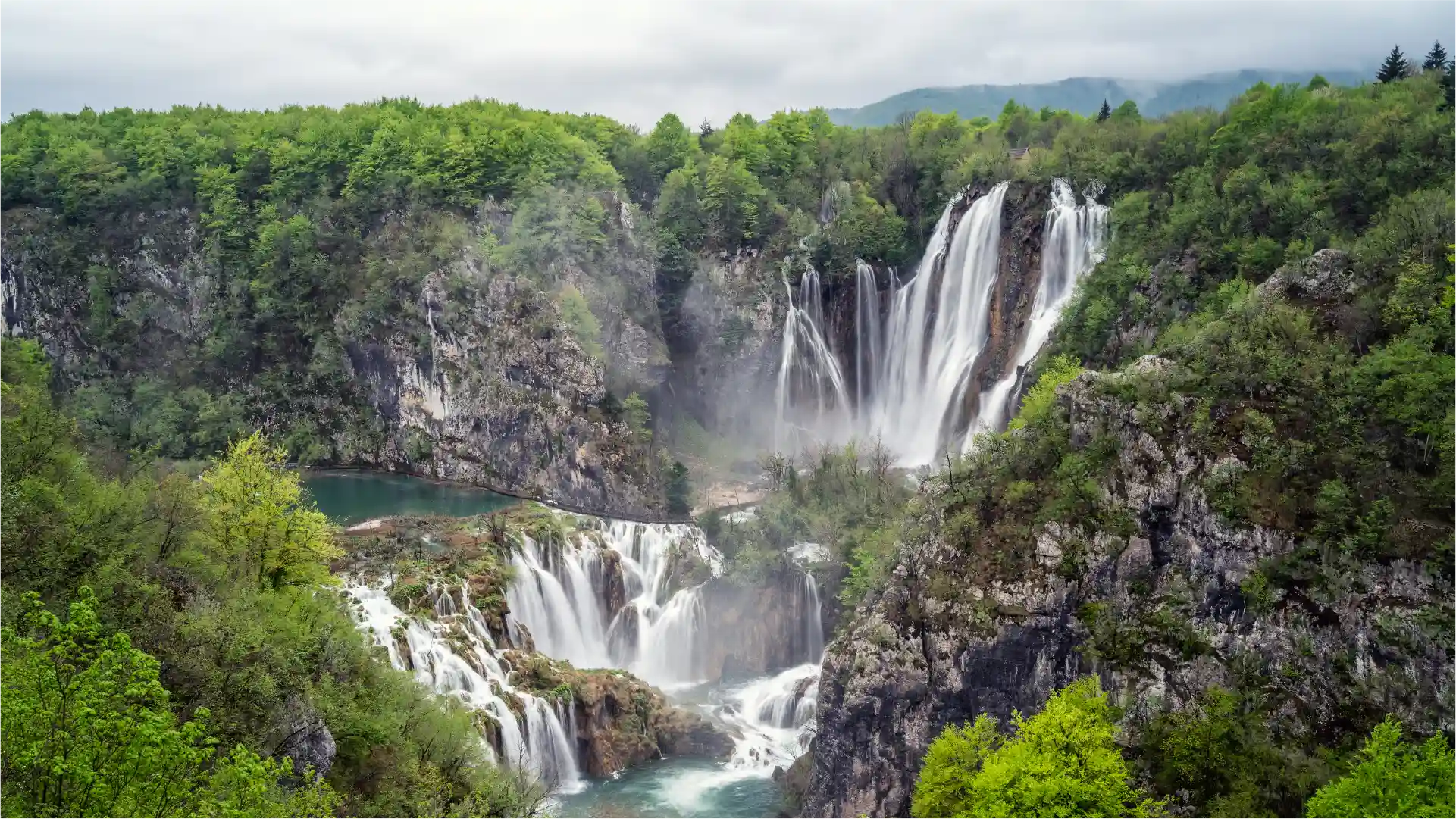Veliki Slap (Large Waterfall), Plitvice Lakes National Park, Croatia A large waterfall (Veliki Slap) cascading into turquoise pools at Plitvice Lakes National Park, Croatia.